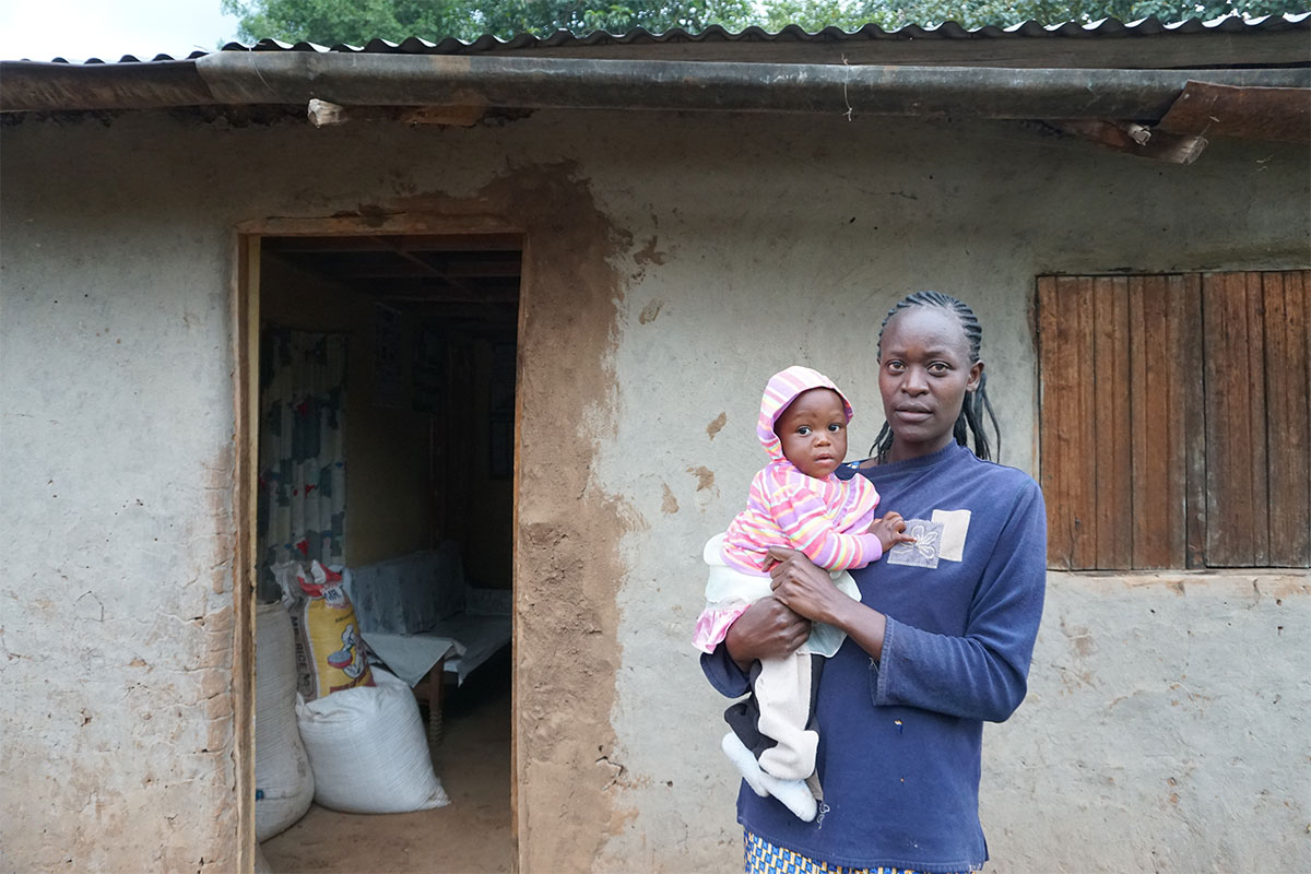 woman grows beans in Kenya to meet family needs