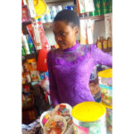 Miss Biira in her cosmetics shop