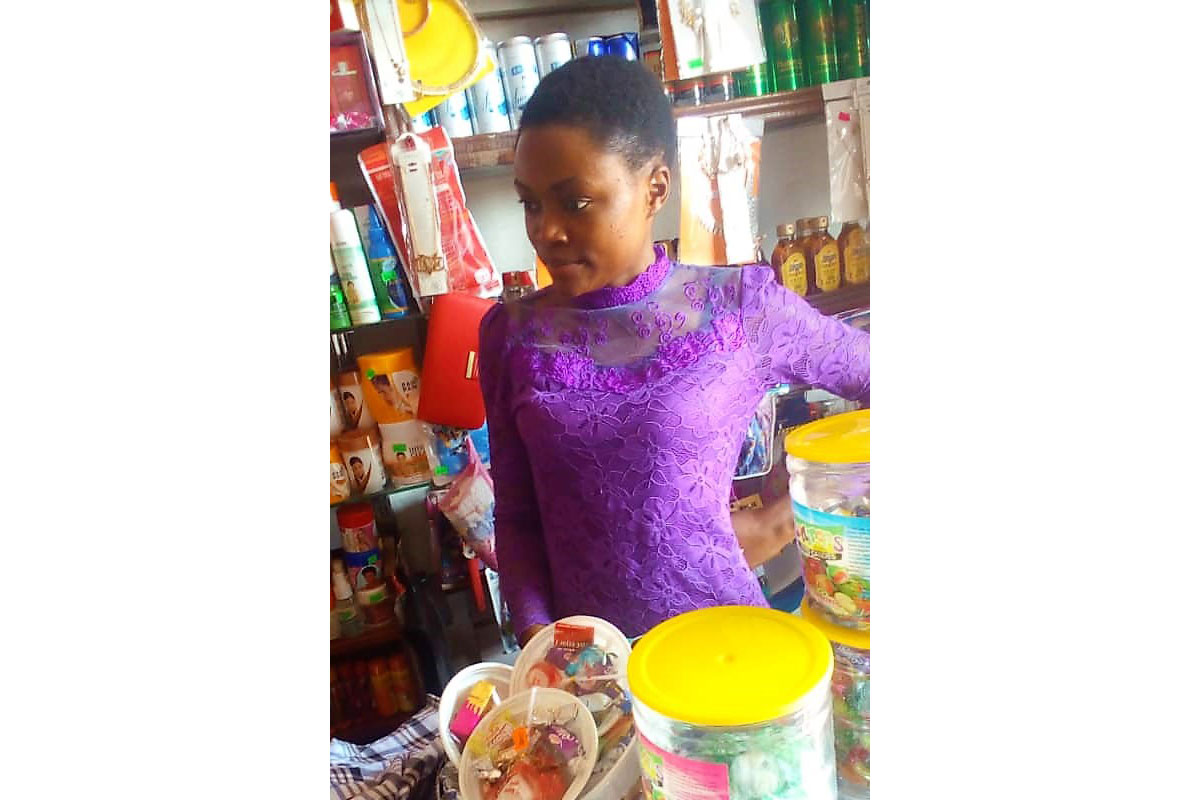 Miss Biira in her cosmetics shop