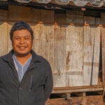savings group member in Thailand saving money for his daughter's education