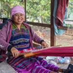 woman saving to buy yarn to make traditional bags