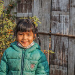 young girl saving for school fees in Thailand