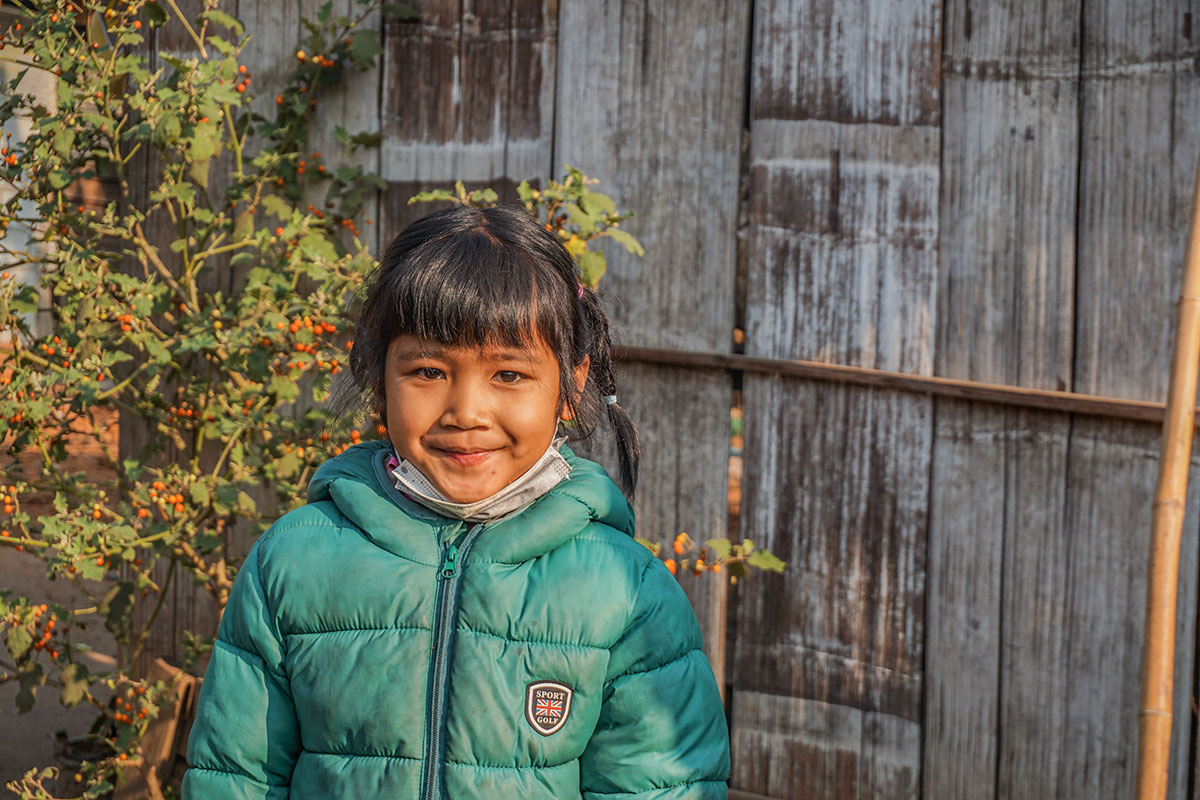 young girl saving for school fees in Thailand