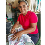 woman benefits from saving wisely as savings group member in El Salvador