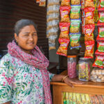 Arati, a savings group member, in her snack shop