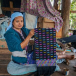 Karen woman saving and borrowing to meet family needs
