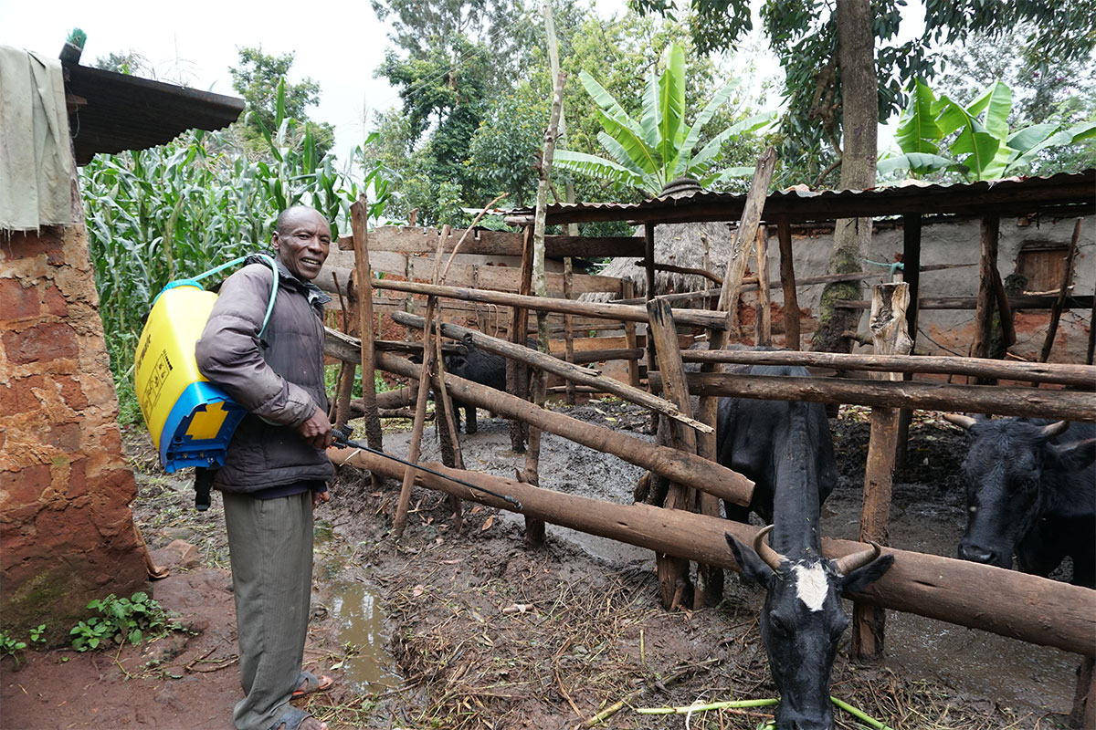 dairy farmer in Kenya purchased sprayer with savings and loan