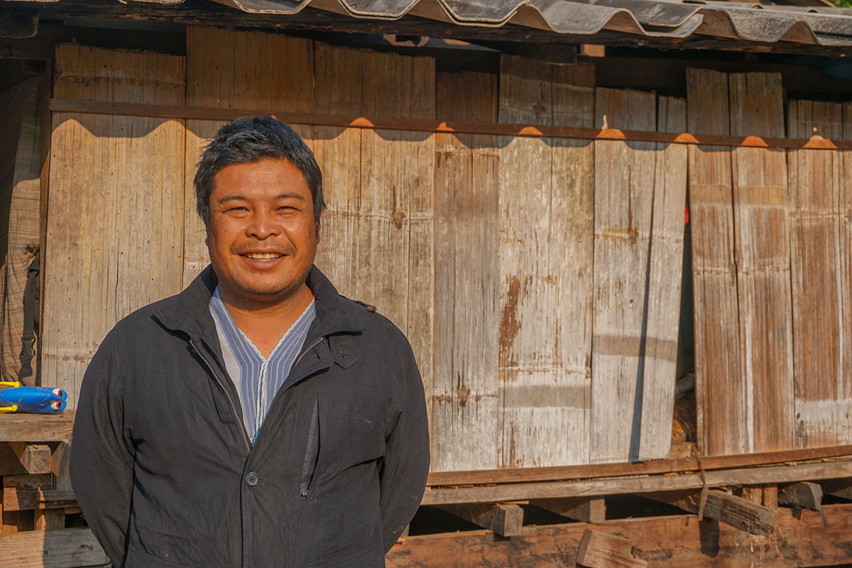 savings group member in Thailand saving money for his daughter's education