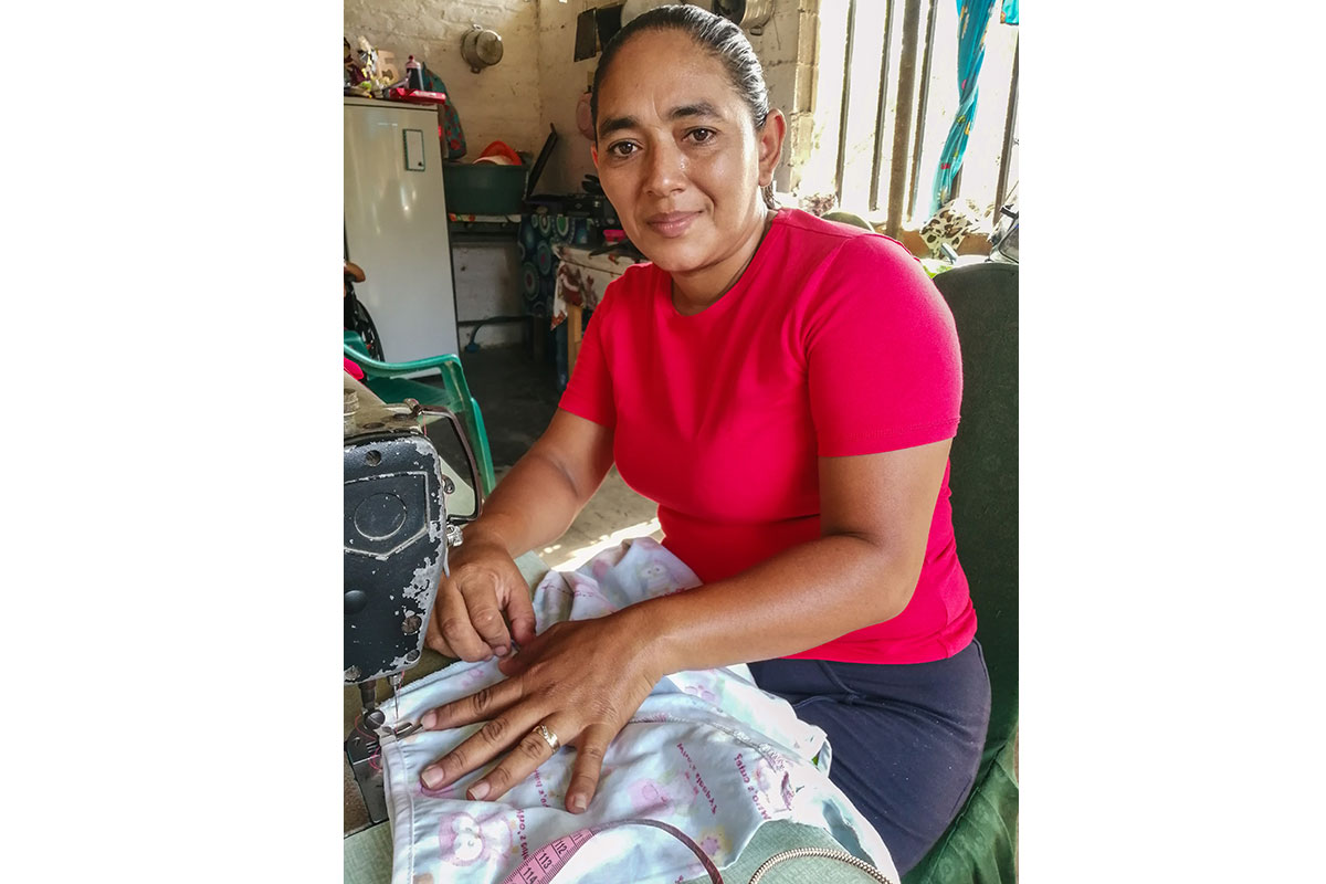 woman benefits from saving wisely as savings group member in El Salvador