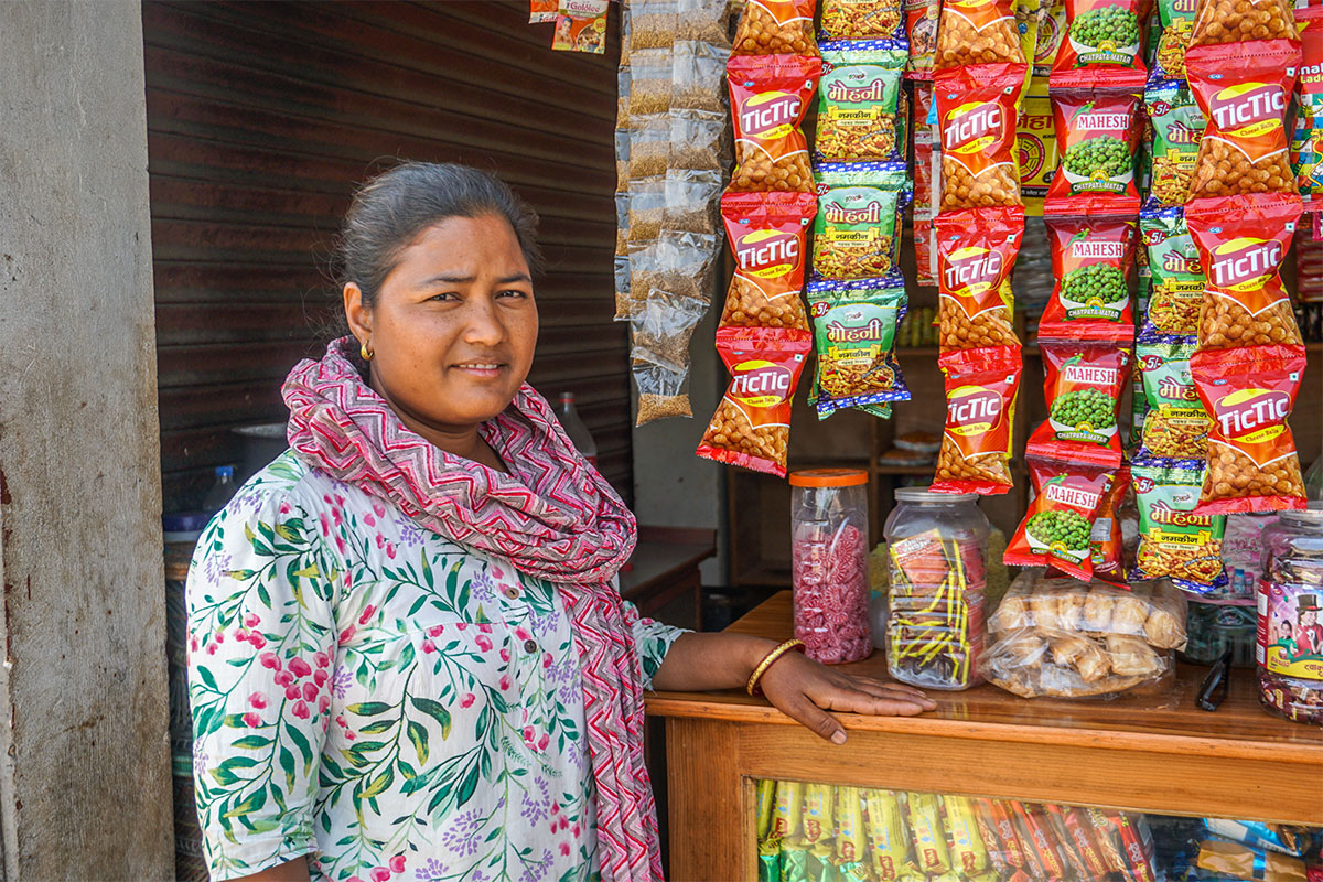 Arati, a savings group member, in her snack shop